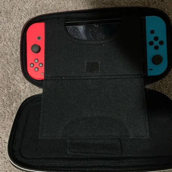 Nintendo Switch Handheld Console with Black Accessories